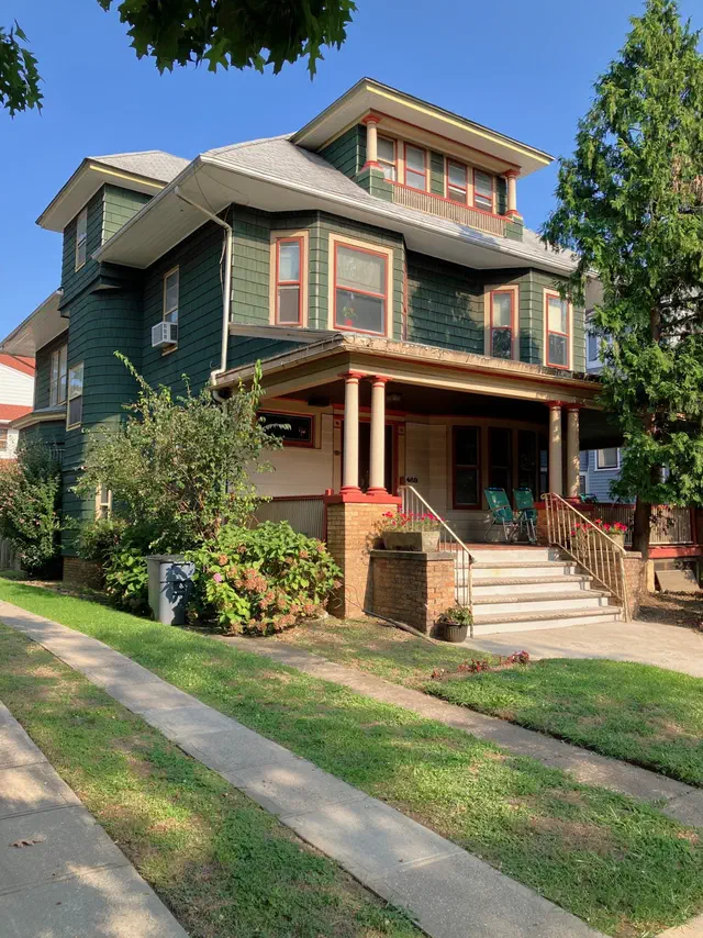 The American Foursquare (1895-1930) is the no-nonsense answer to the late-Victorian — a square box on a square plan with a hipped roof, full porch, and four big rooms per floor.