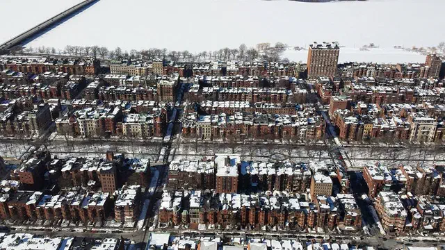 The Back Bay Brownstone (1857-1900) is Boston's grand Victorian rowhouse — chocolate-brown sandstone facades, high stoops, and a 25-foot lot width on the Mill Pond's reclaimed land.