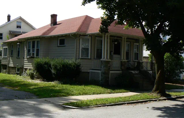 The Bungalow / Craftsman style (1905-1930) brought West Coast Arts and Crafts ideals to Massachusetts streetcar suburbs — low-pitched gables, deep porches, exposed rafter tails, and honest materials.