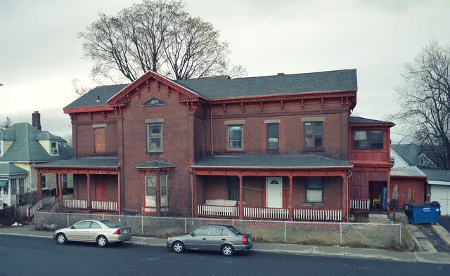 The Italianate (1840–1890) replaced Greek Revival's austerity with Mediterranean villa motifs — towers, bracketed eaves, paired round-arched windows. The South End and Back Bay are paved in them.