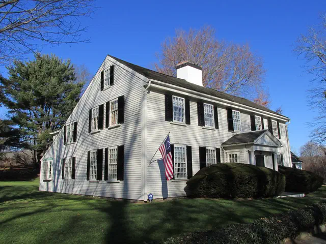 The Saltbox — a colonial-era vernacular with a long, sloping back roof — is one of New England's most distinctive house forms. Original 17th- and 18th-century examples survive in Essex County and along the South Shore.